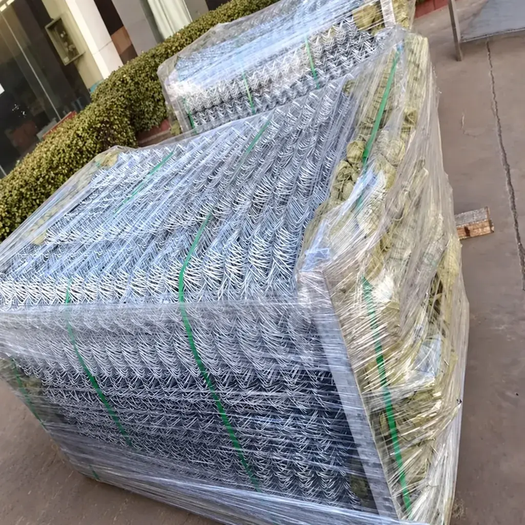 Galvanised chain link mesh rolls wrapped for storage