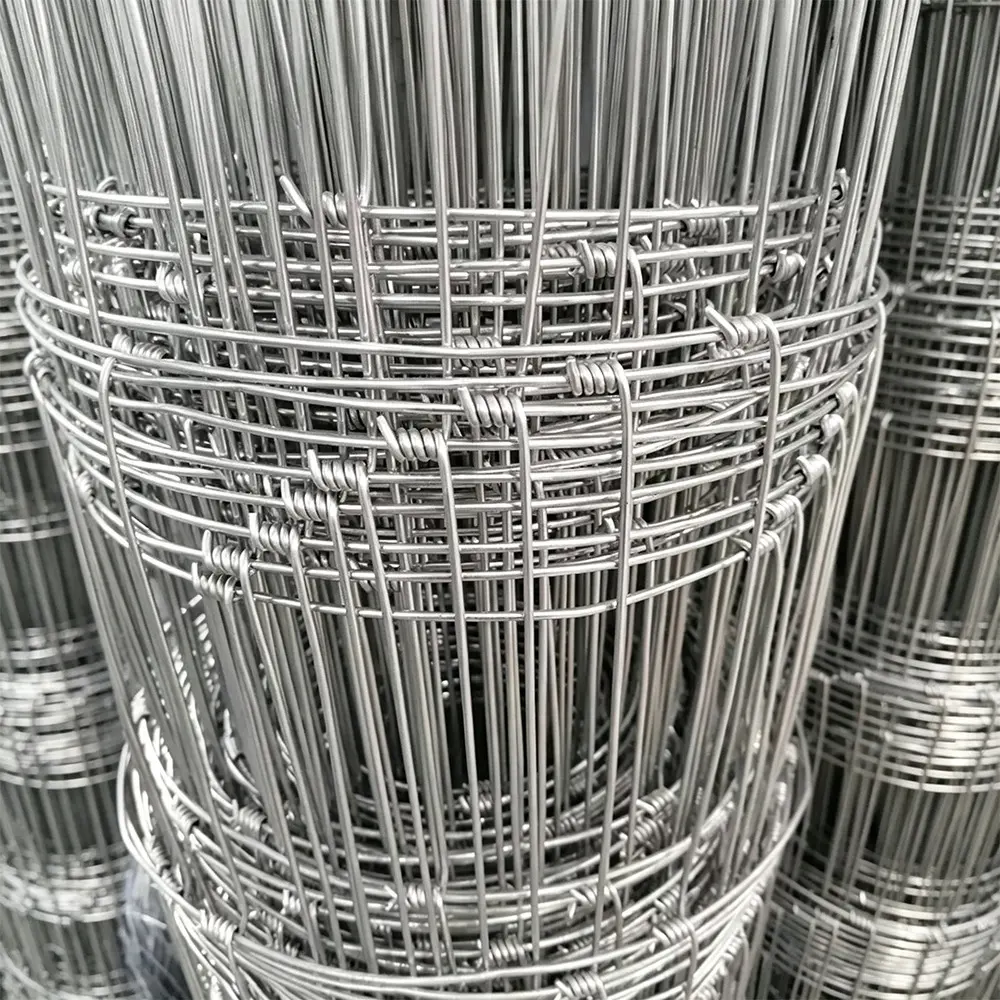 Close-up of hinge-joint wire mesh wound into rolls
