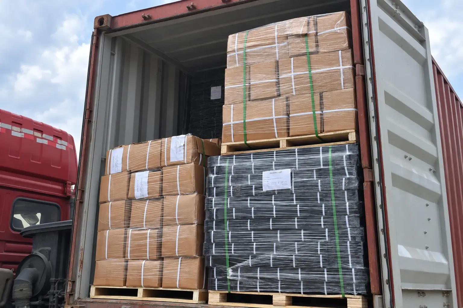 Strapped and wrapped pallets with packing labels inside a shipping container