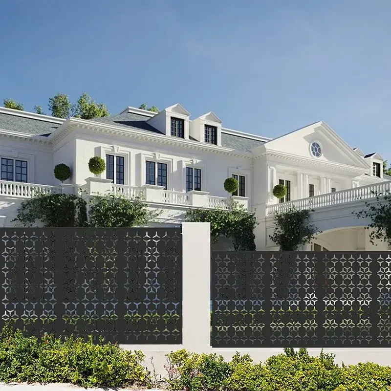 Multi-bay black laser-cut fence screen outside a house