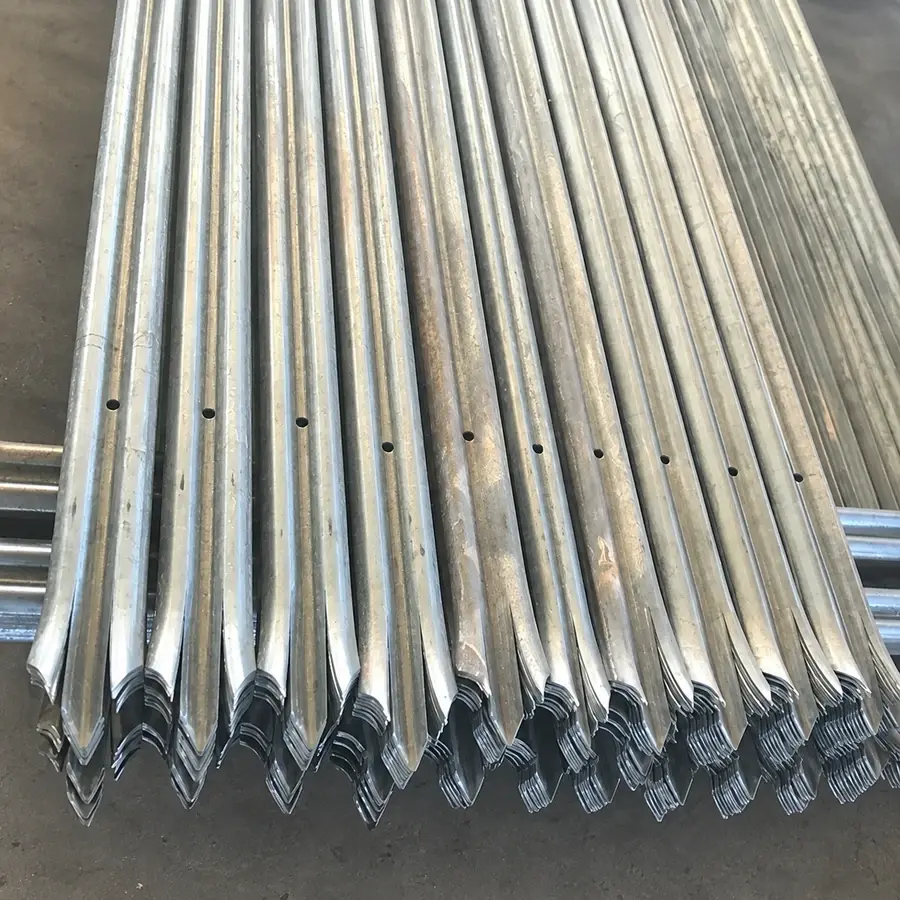 Stacked steel pales showing pointed ends and fixing holes