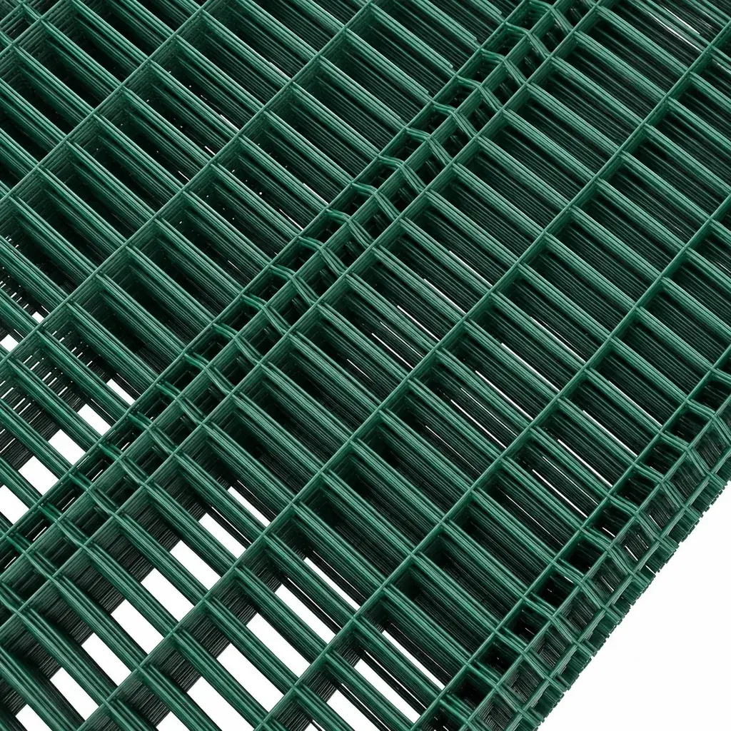 Stacked green welded mesh panels with V-shaped reinforcement bends