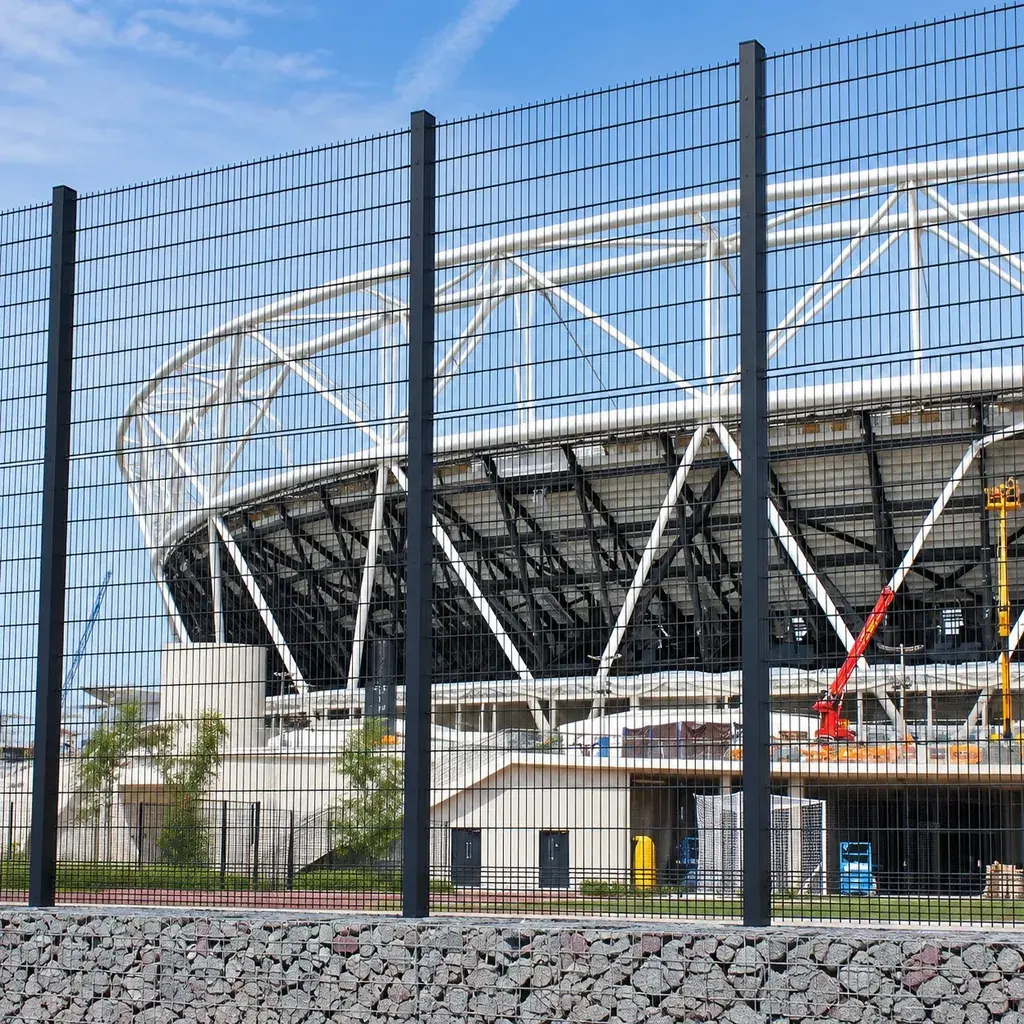 Grey double-wire fence panels outside a stadium