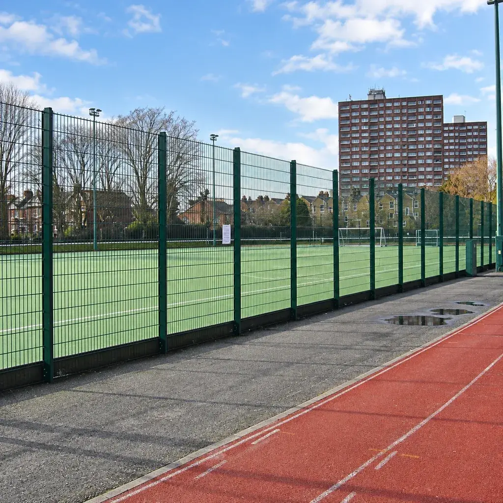Double-wire sports fencing around an outdoor playing court