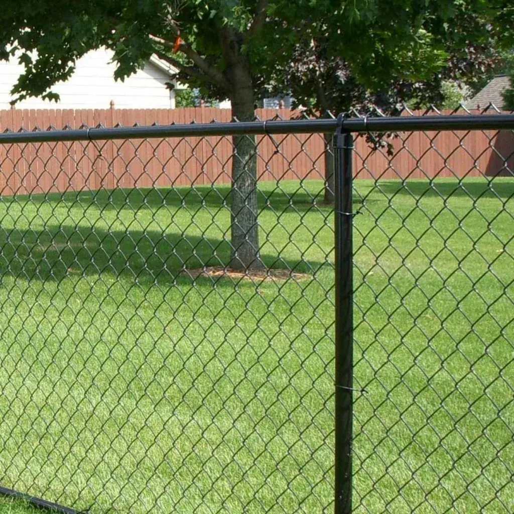 Black PVC-coated chain link fence installed beside a sports field