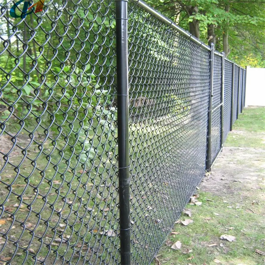 Dark coated chain link fence and matching posts along a path
