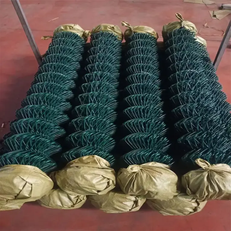 Rolls of dark green PVC-coated chain link fabric