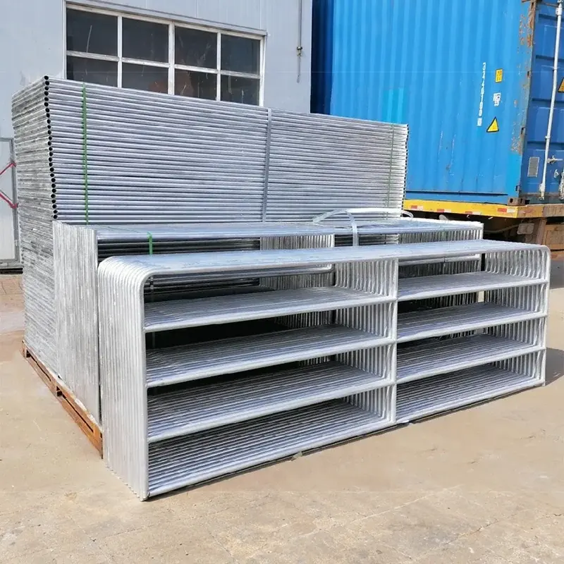 Stacked galvanised five-bar farm gate leaves ready for dispatch