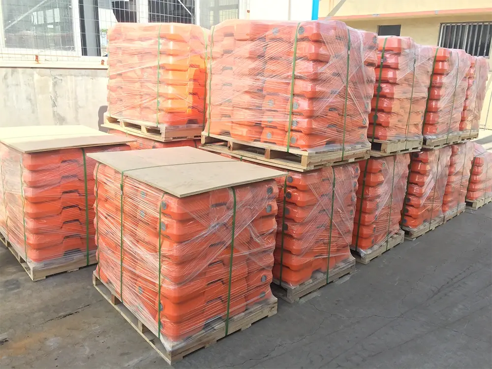 Pallets of temporary fence bases prepared for site delivery