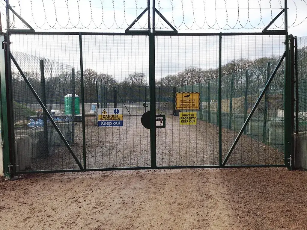 Rapid deployment mesh gate and adjoining fence panels