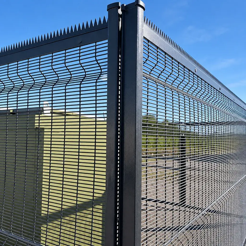 Profiled close-spaced mesh panels fixed to a dark corner post