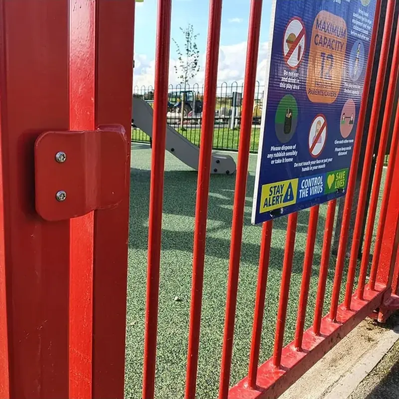 Bump stop on a red playground gate post