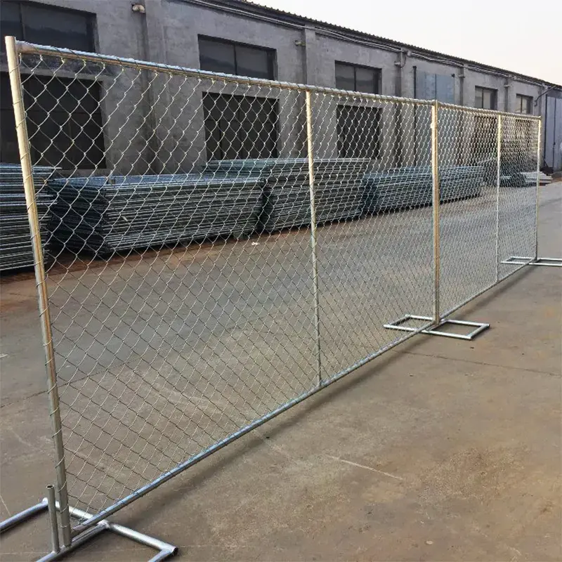 Temporary chain link panels along an industrial building