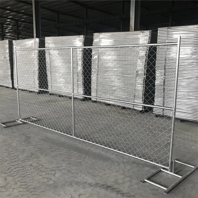 Temporary chain link panels standing in front of wrapped stock