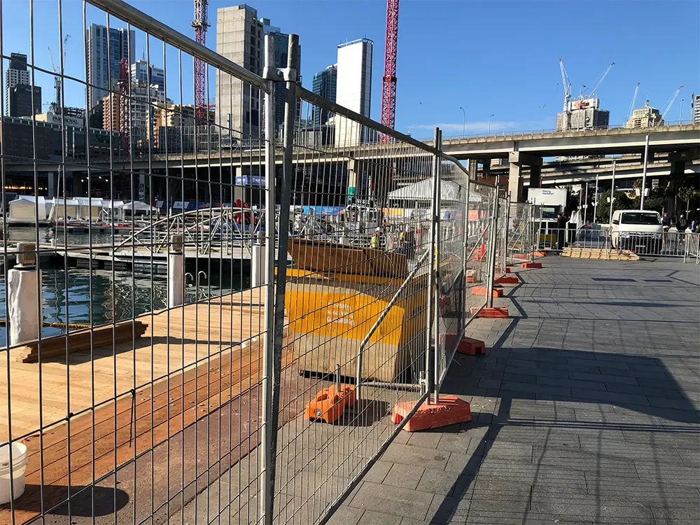 Temporary welded mesh fencing surrounding an urban work site