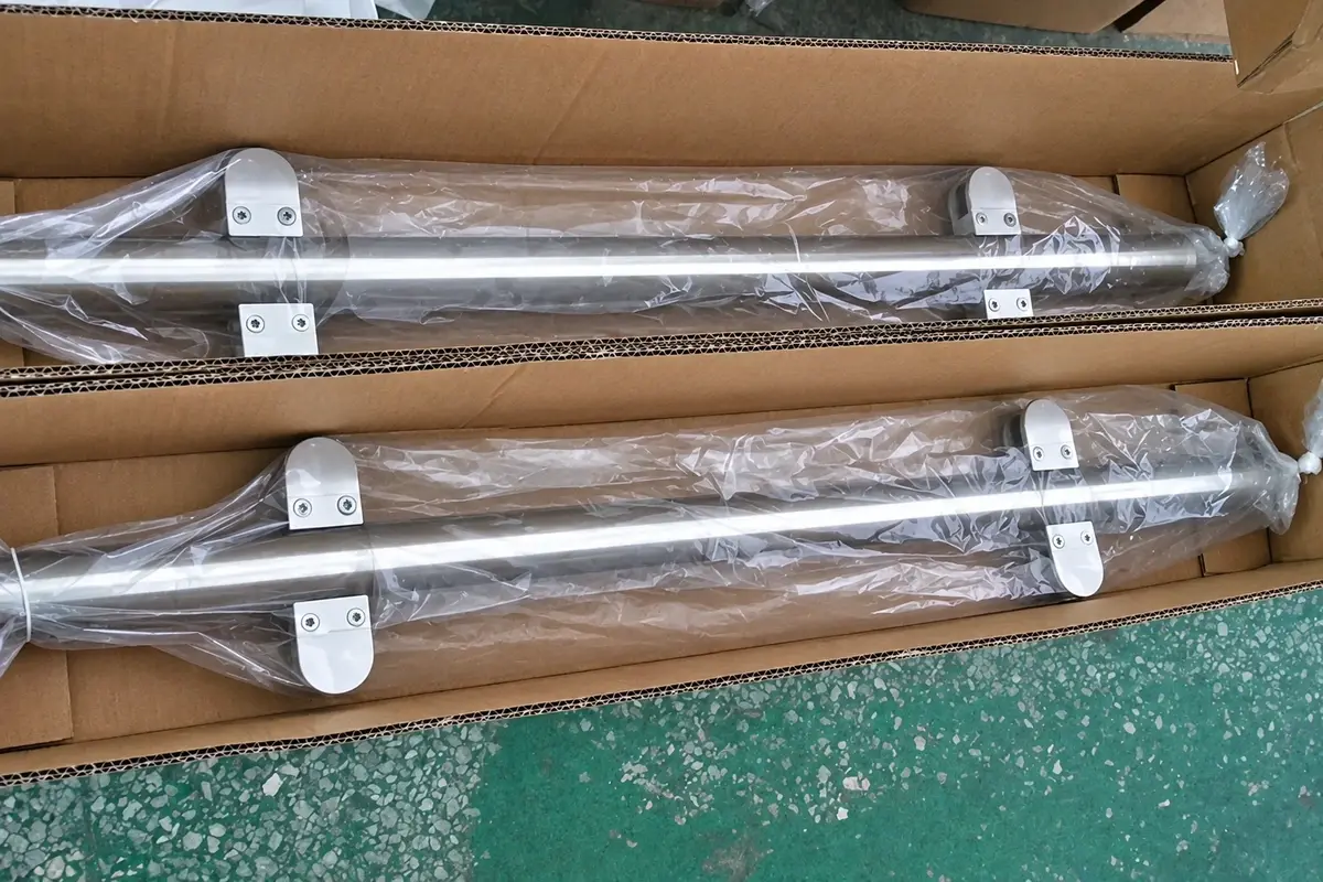 Metal fence posts packed in cardboard cartons with clear wrapping