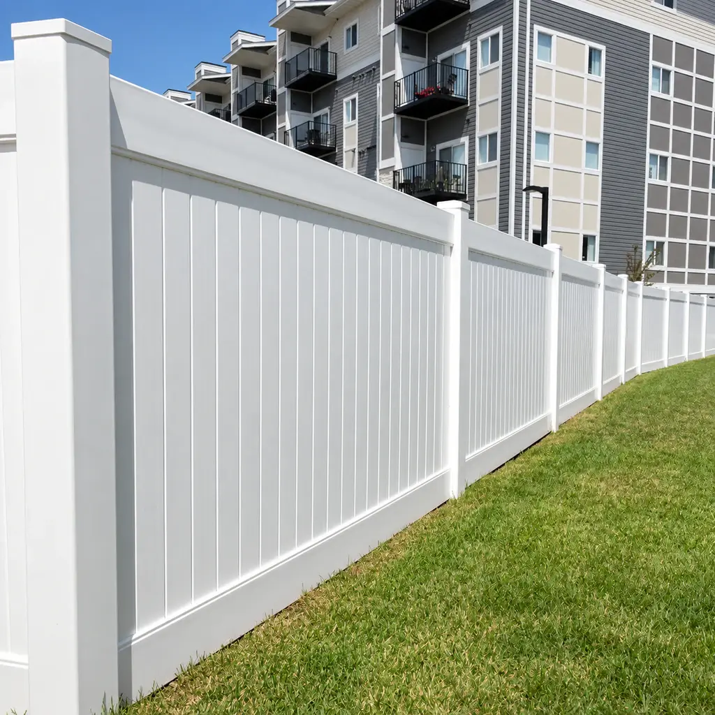White PVC privacy fence along a row of homes